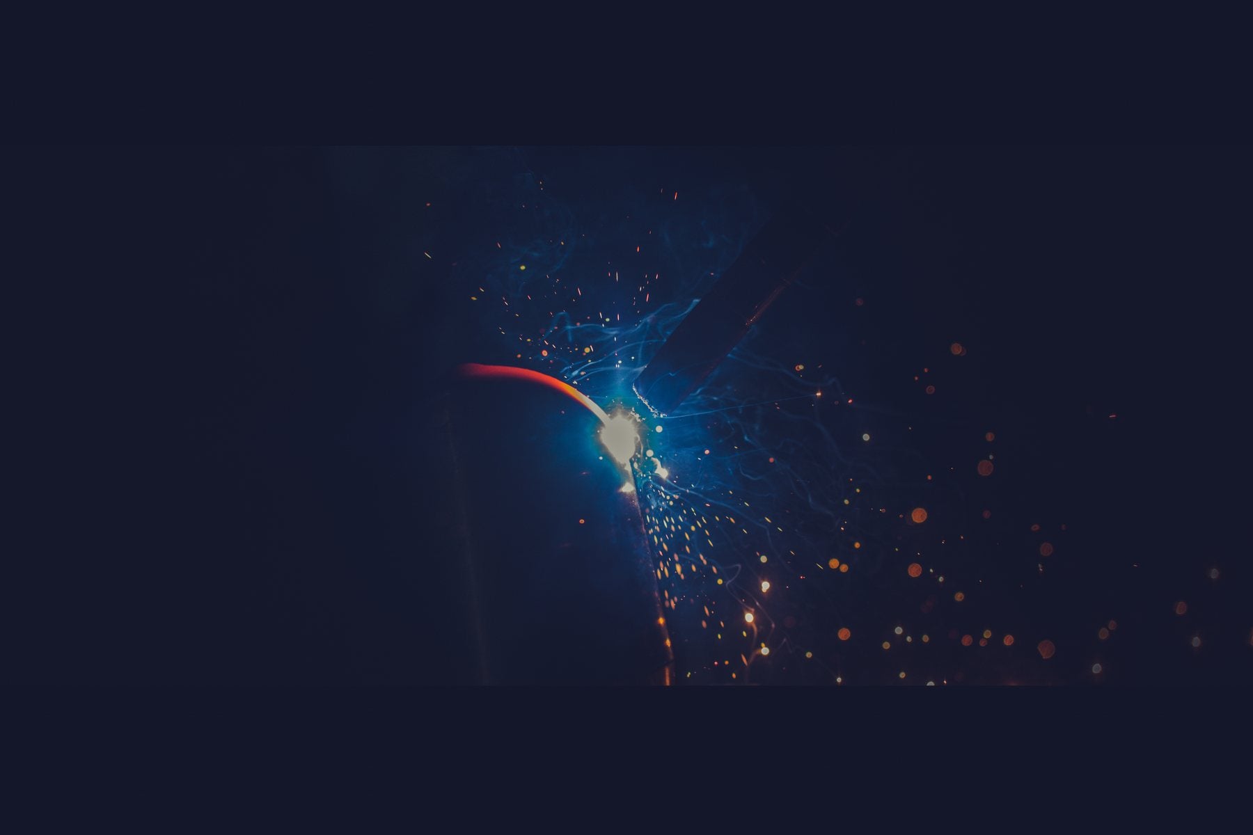 Welding sparks during truck DEF pipe fabrication process